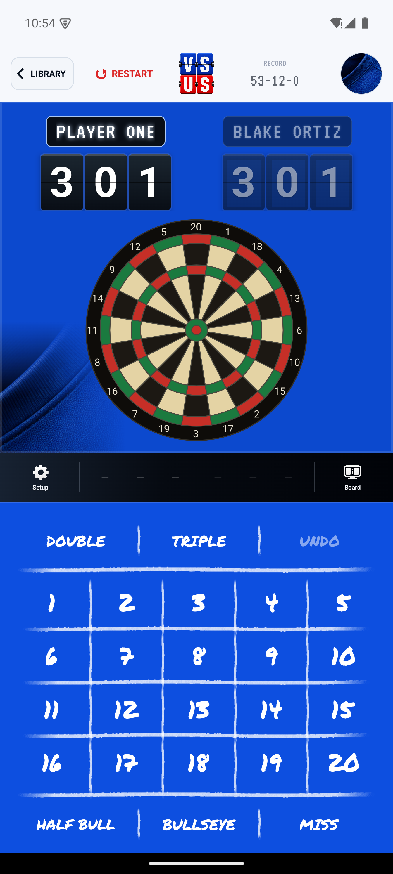 VS US Darts scoring screen with dartboard, score totals, and number controls.